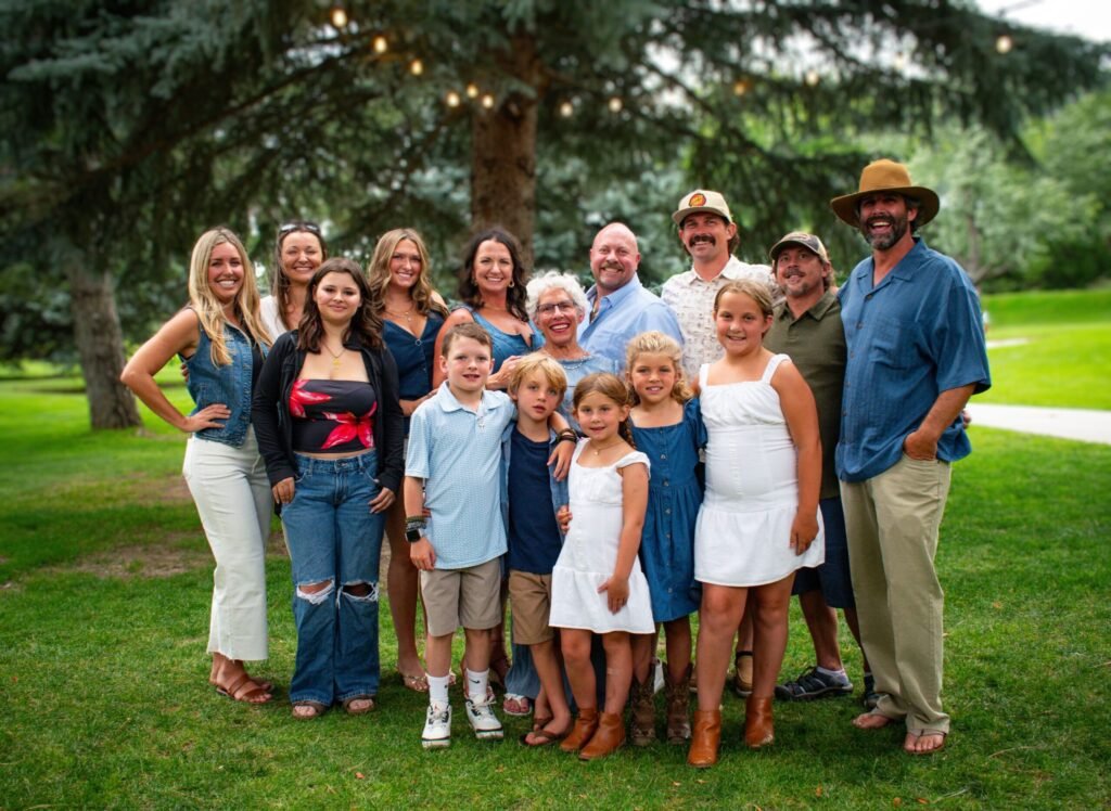 A family posing for a photo in a park.